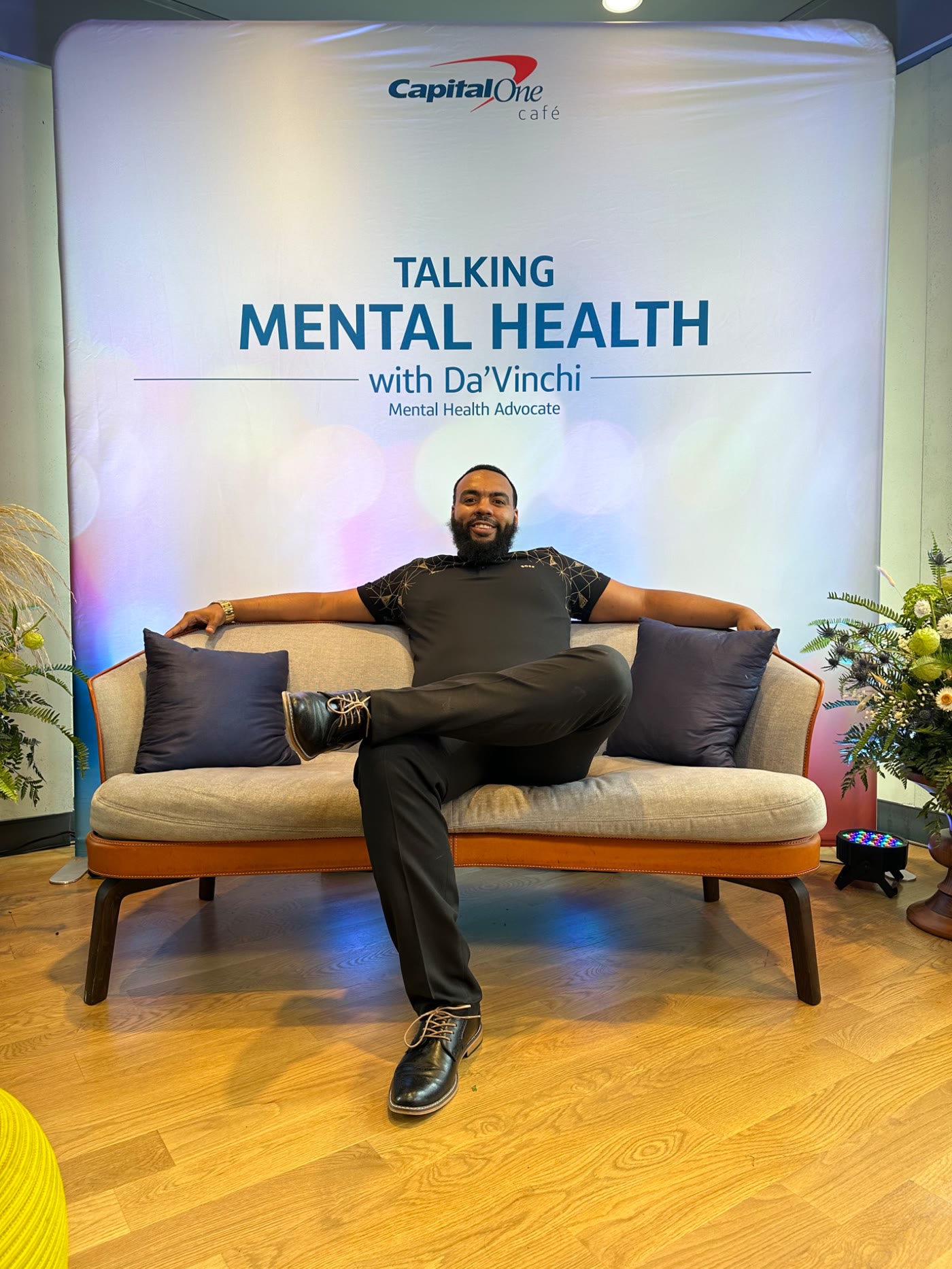 Jaytee Miller seated at the Capital One Cafe "Talking Mental Health" event